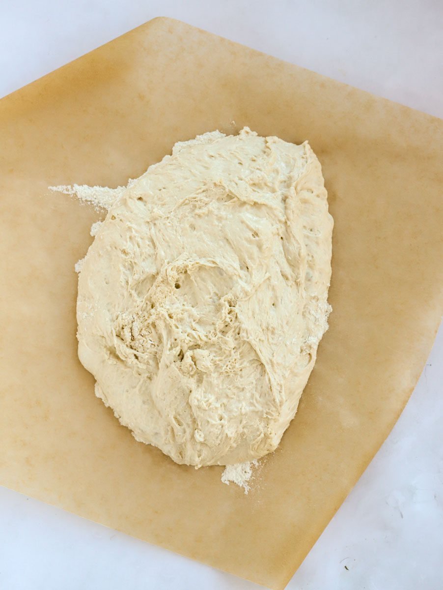 Dollop of dough on baking paper for step 3 in the recipe process.