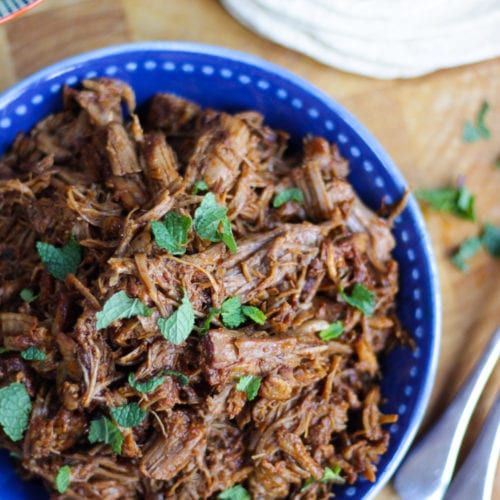 Instant Pot Pulled pork in a blue bowl with wraps