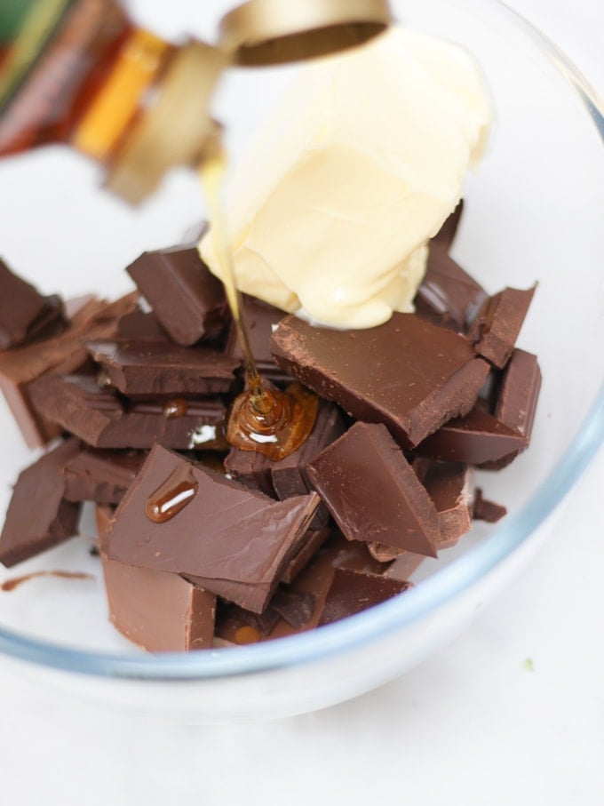 Chocolate, golden syrup and butter in a bowl for step 1 in the Malteser Rocky Road recipe.