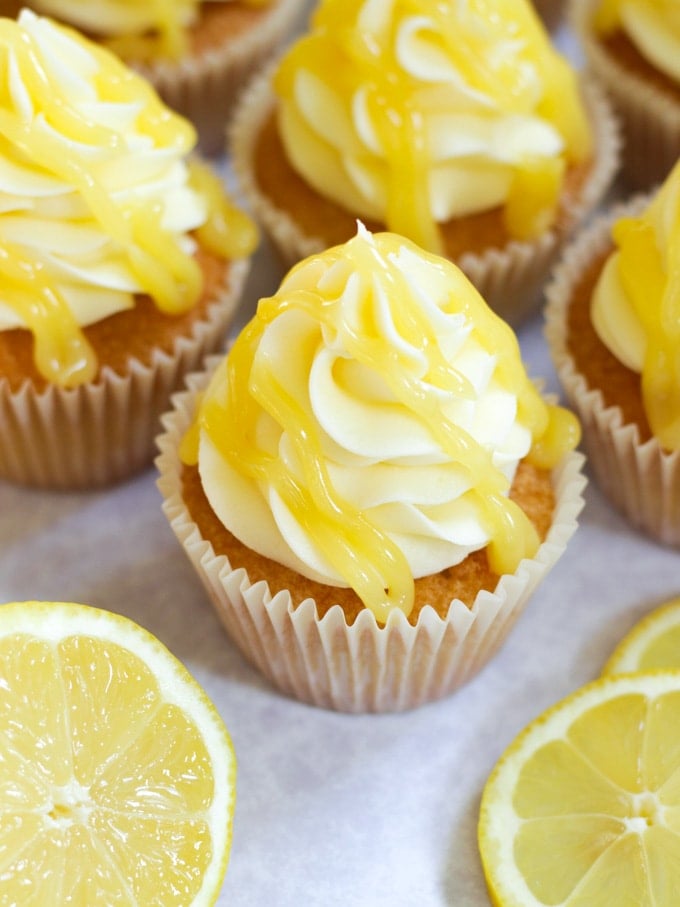 Lemon drizzle cupcakes topped with lemon buttercream and lemon curd topping.