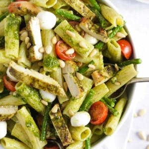 Easy chicken pasta with green pesto, veggies and cheese