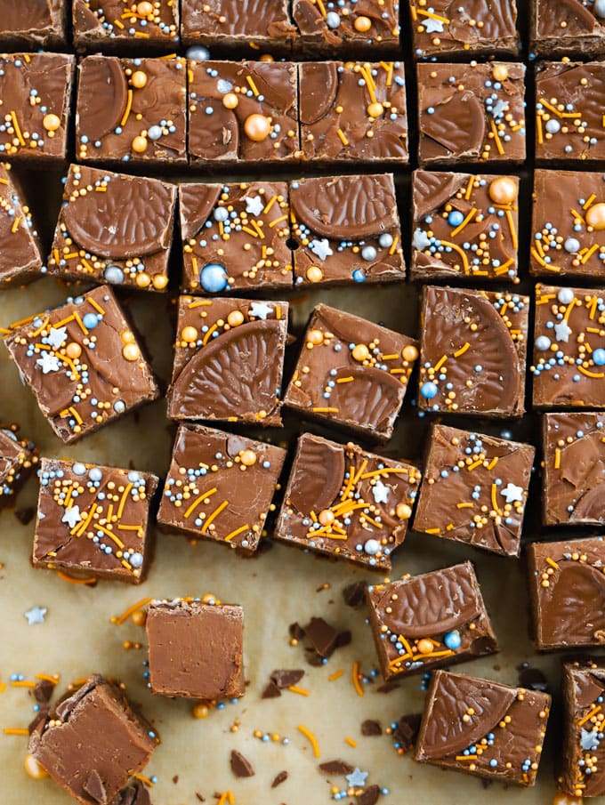 Chocolate orange fudge squares with sprinkles on top.