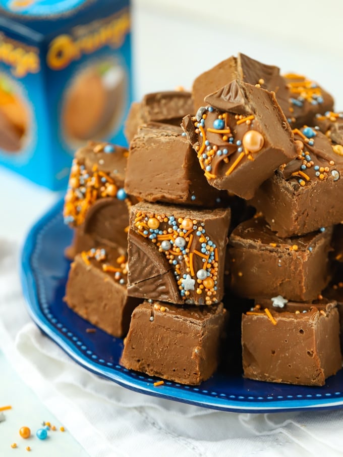Terry's Chocolate Orange Fudge squares, piled high on a plate, ready to eat.