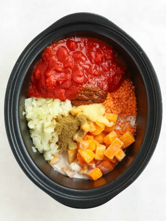 Raw ingredients for a Slow Cooker Dahl ready in the pan.