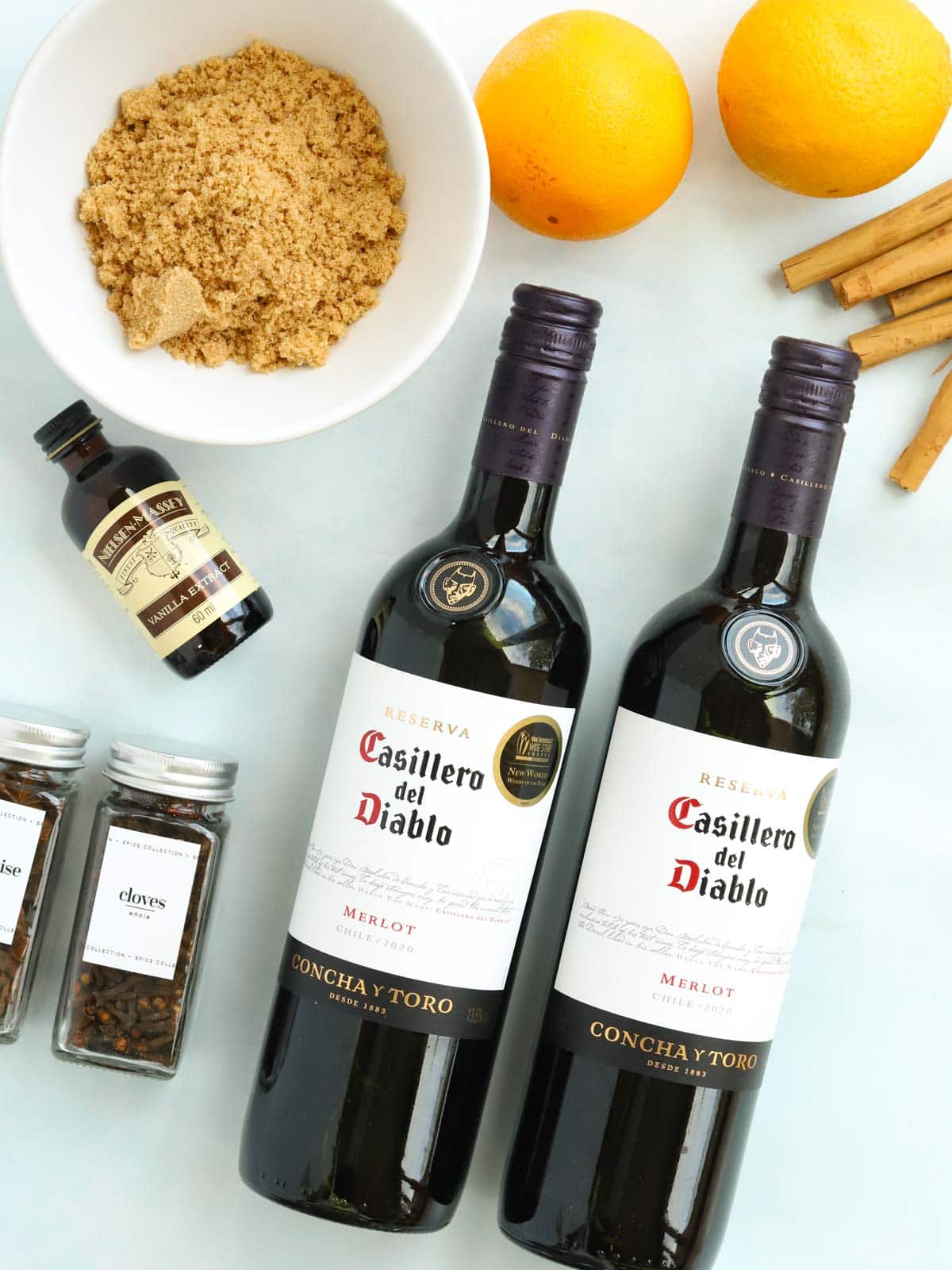 Ingredients for Slow Cooker Mulled Wine recipe laid on a counter.