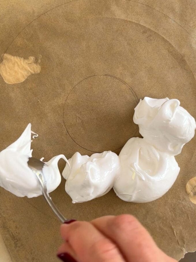 Step 4 in the recipe for Christmas Wreath Pavlova.