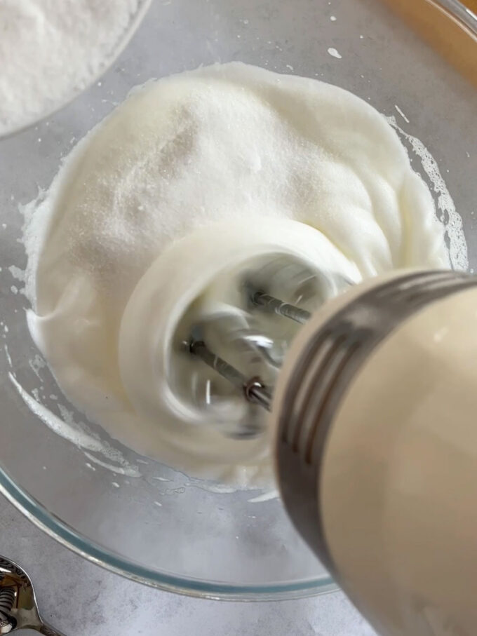 Step 2 in the recipe for Christmas Wreath Pavlova.