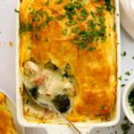 Chicken and Ham Pie with golden crust being served straight out of the oven.