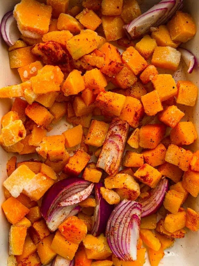 Red onion and cubes of roasted butternut squash.