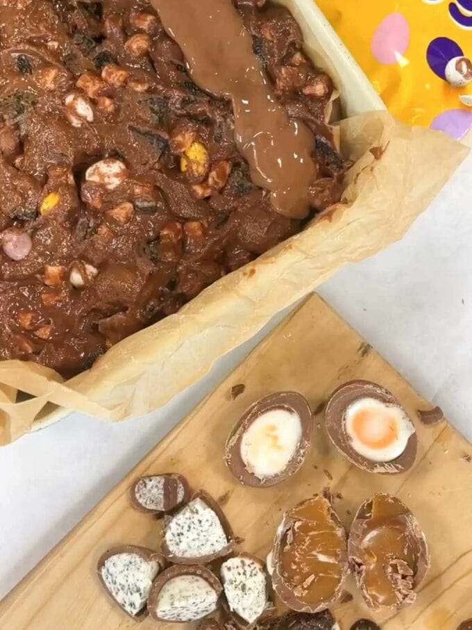 Melted chocolate into a baking tin and add easter egg toppings.