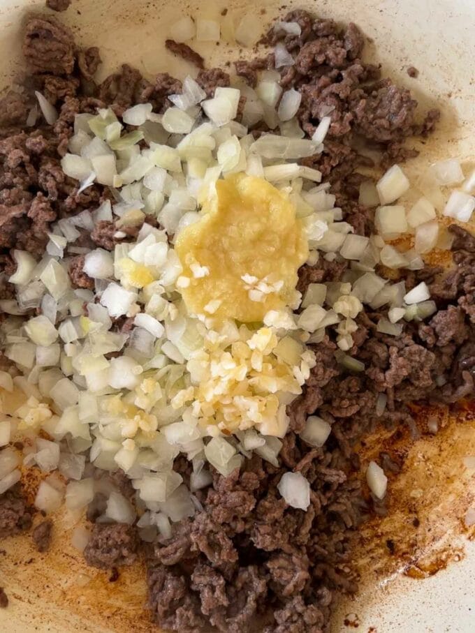 Beef mince, onion and garlic in a pan for the first step in the recipe for Beef Fried Rice.