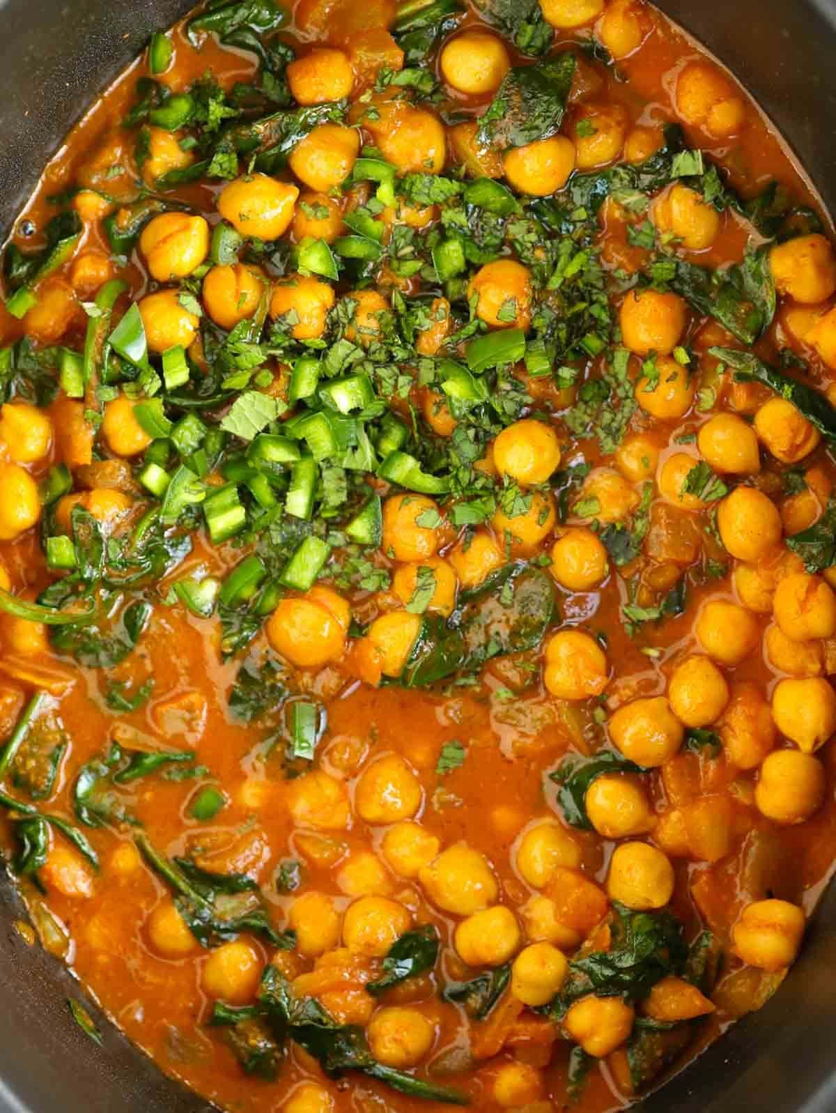 Close up of cooked curry with chickpeas.