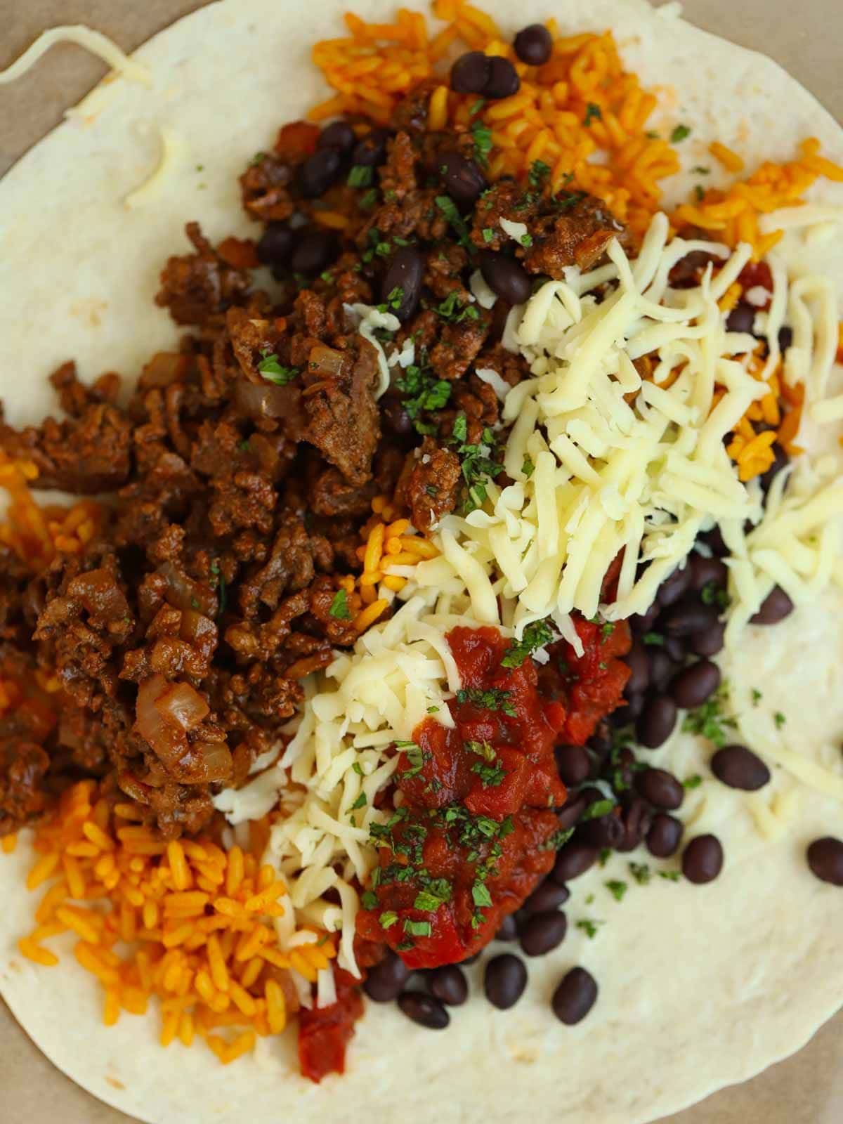 Beef Burritos filling before they're rolled up. Mince, rice, beans and cheese.