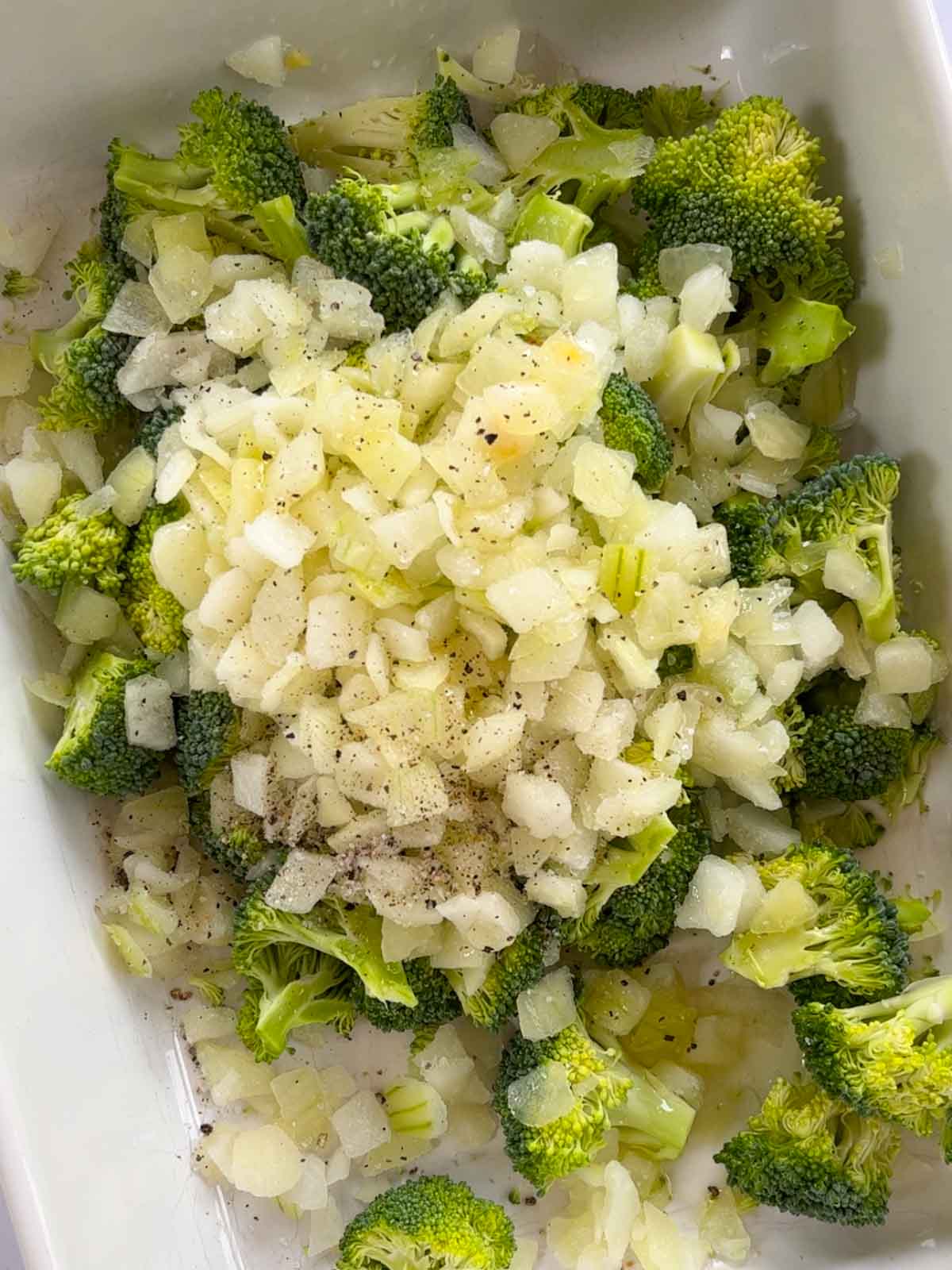 Broccoli and onion in an oven dish.