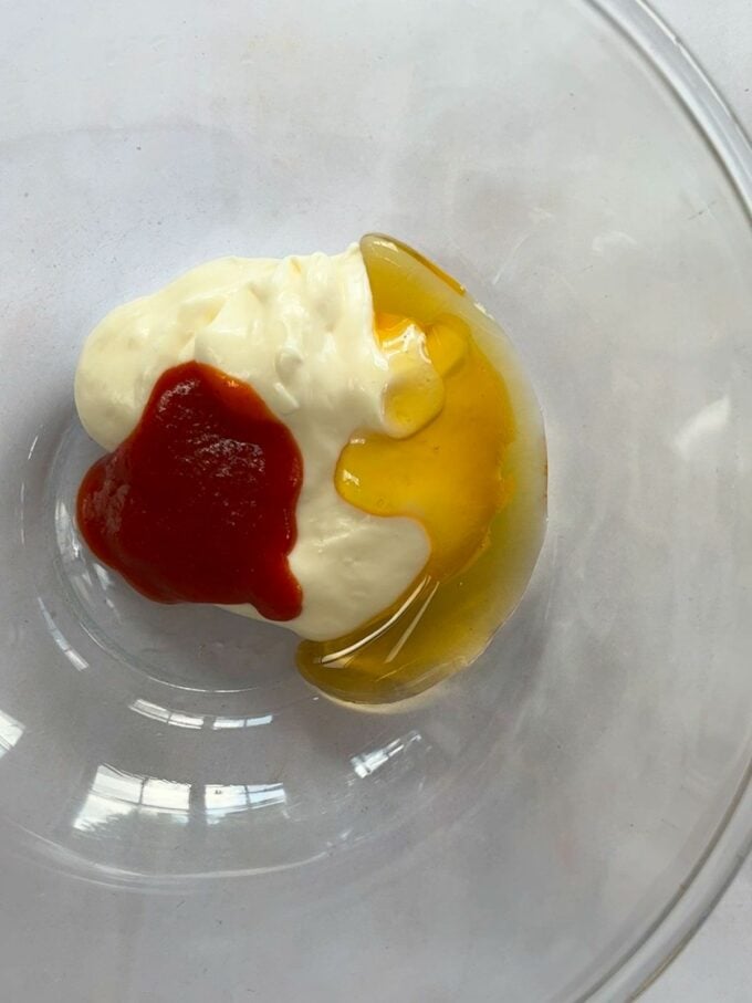 Hot honey sauce ingredients in a bowl.