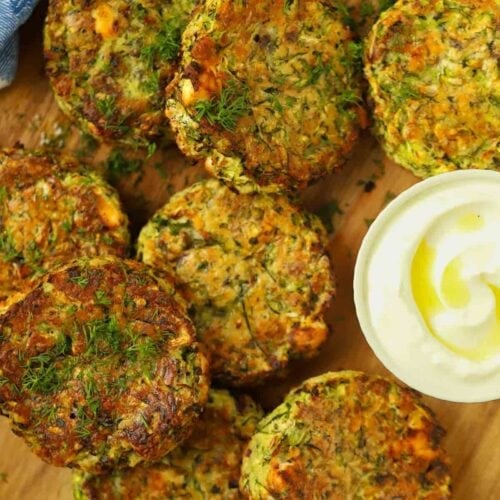 A board filled with cooked courgette fritters.