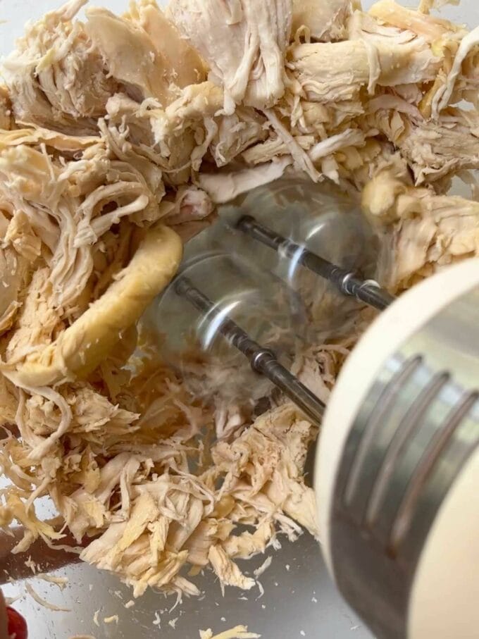 Step 1 in the recipe for Chicken Wraps. Whizz up the cooked meat.