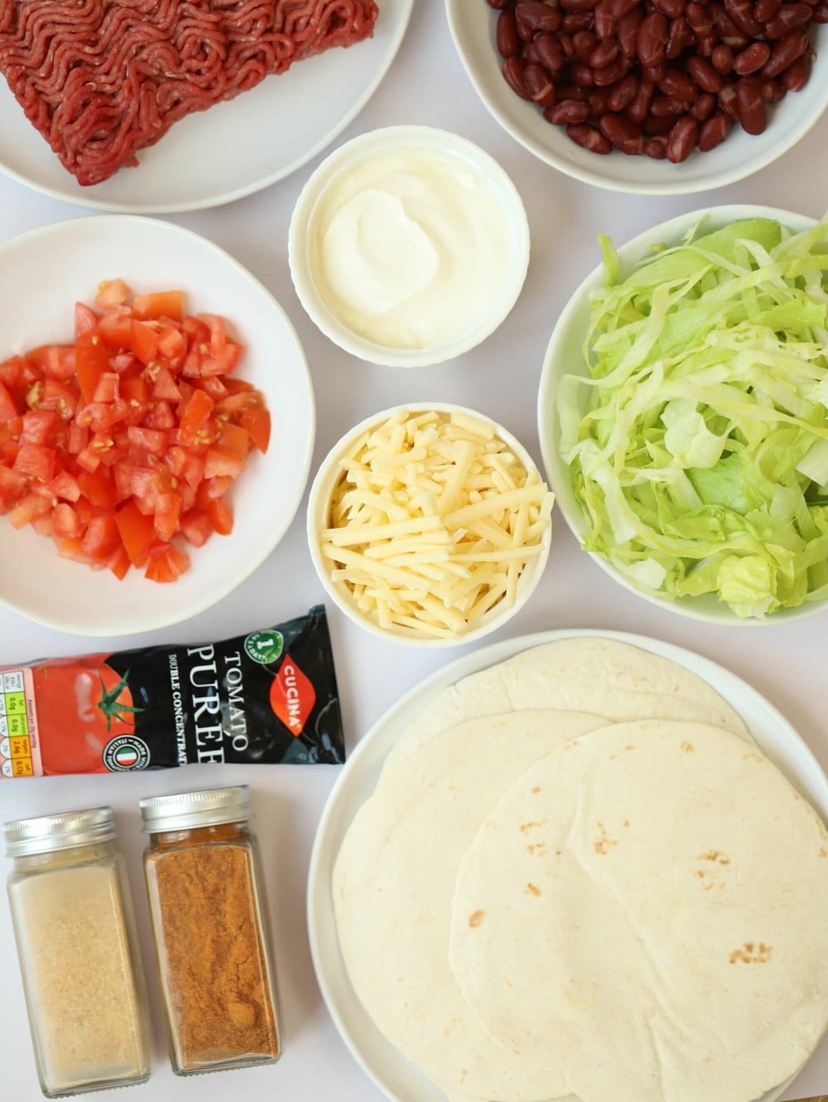 The ingredients for making Easy Beef Tacos laid out on a counter.