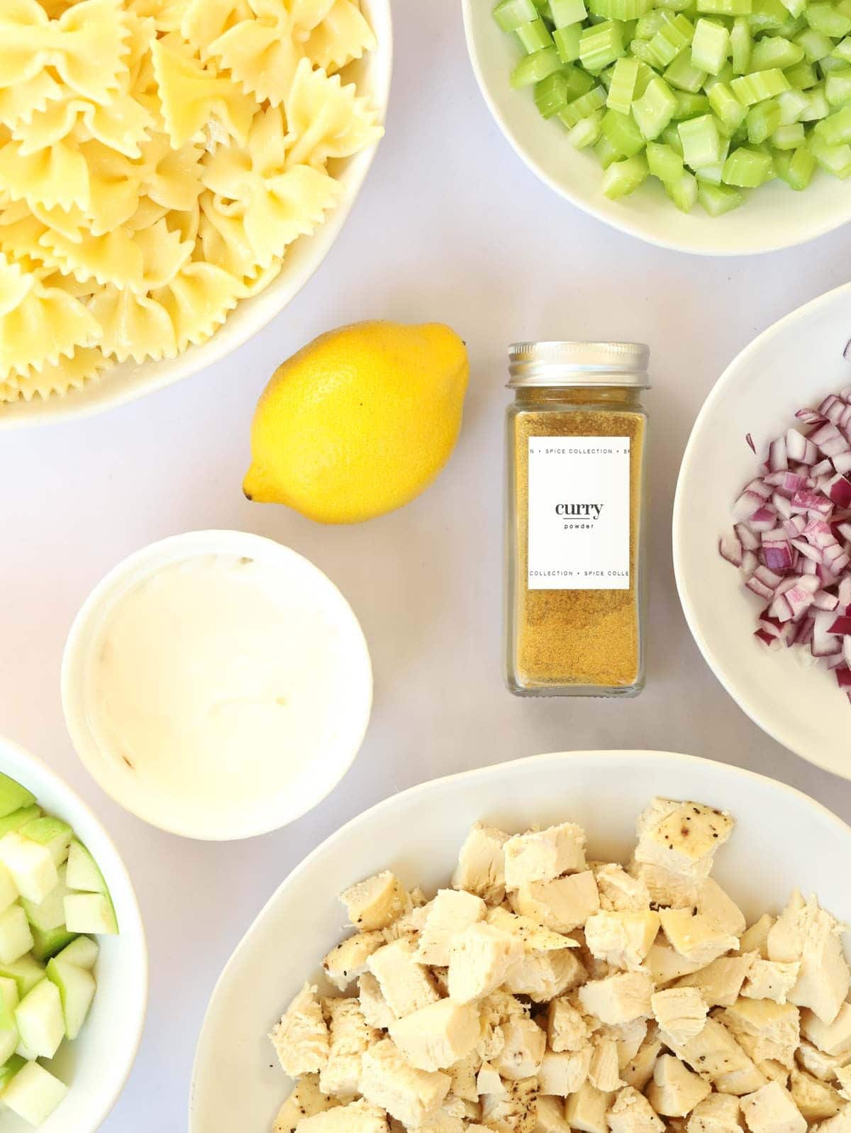 Ingredients for Chicken Pasta Salad laid out on a counter.