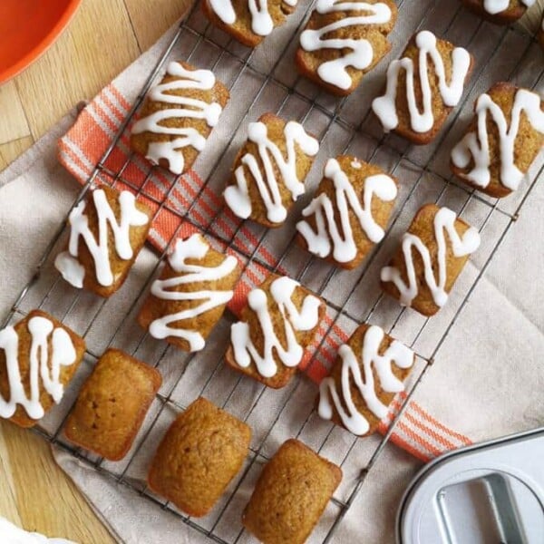 A tray of mini pumpkin bread loaves, ready to serve.