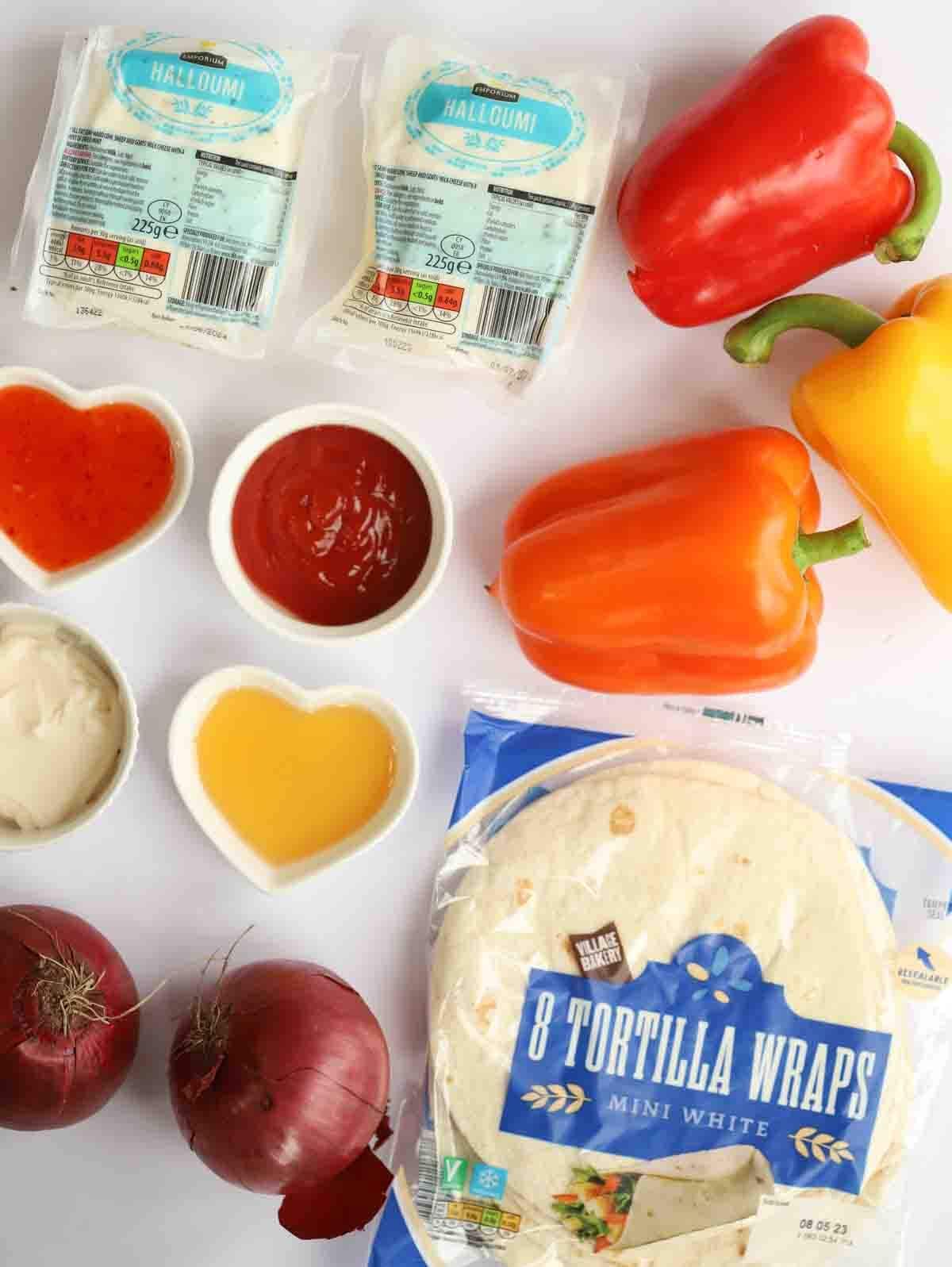 The ingredients for halloumi kebabs laid out on a counter top.