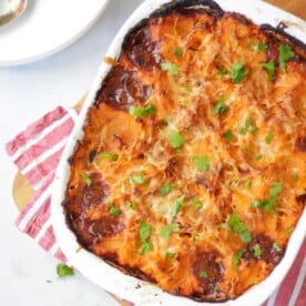 A sweet potato cottage pie looking from above onto a table.