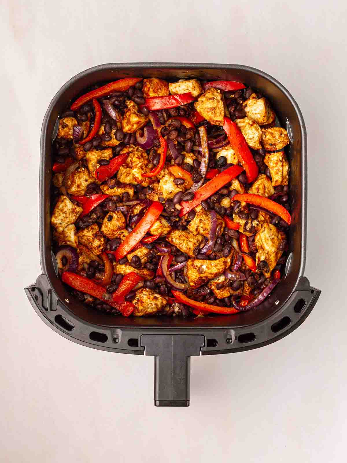 Cooked Air Fryer Mexican Chicken in an air fryer, ready to serve.