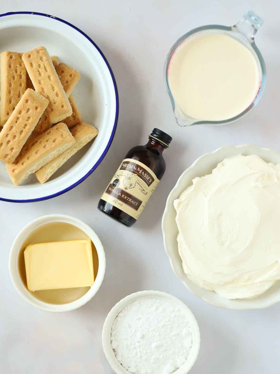 The ingredients for vanilla cheesecake on a counter top.