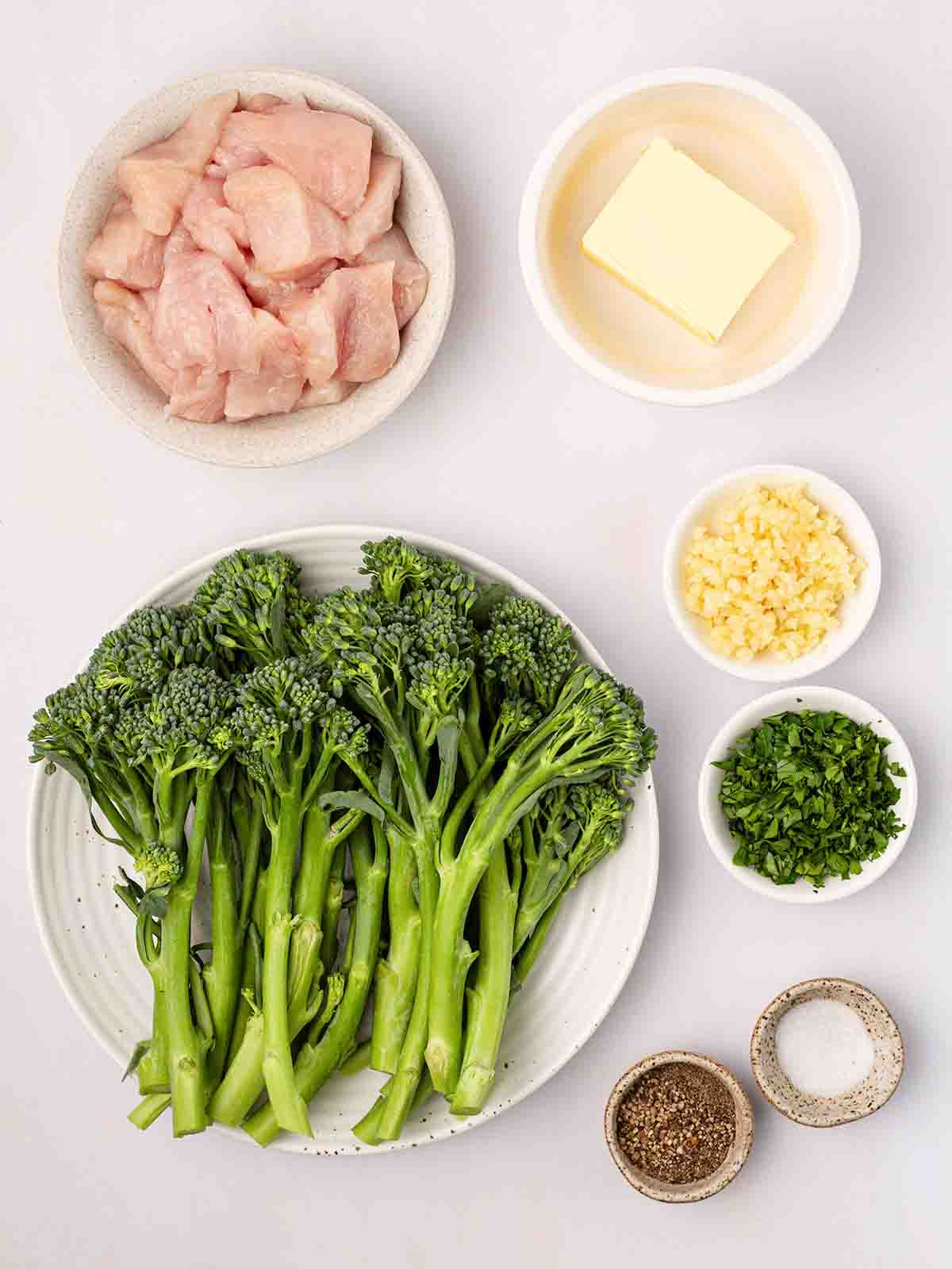 The ingredients for Air Fryer Garlic Butter Chicken laid out on a counter top.