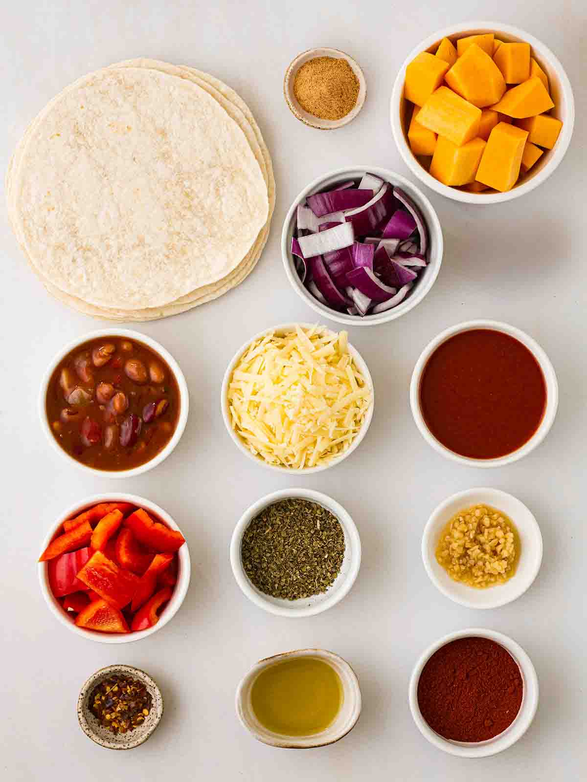 The ingredients for Vegetarian Enchiladas laid out on a counter top.