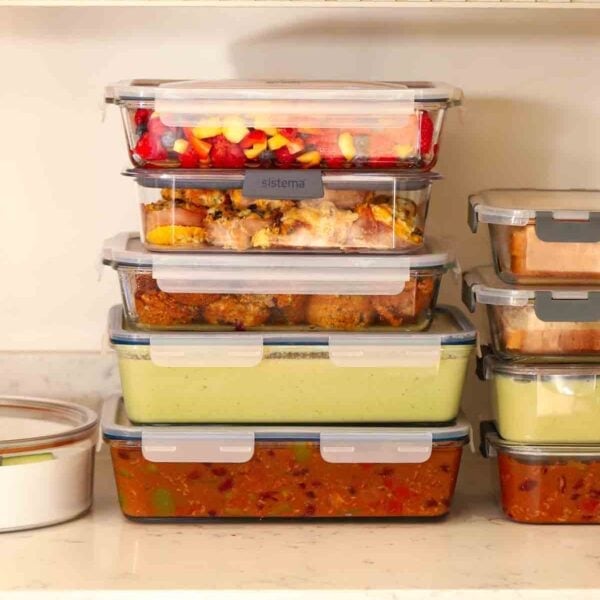 Pile of meal prep filled containers with family food for Sunday Setup