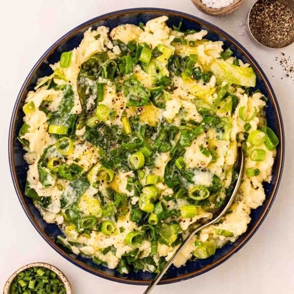 A bowl filled with a bowl of Colcannon mashed potato.