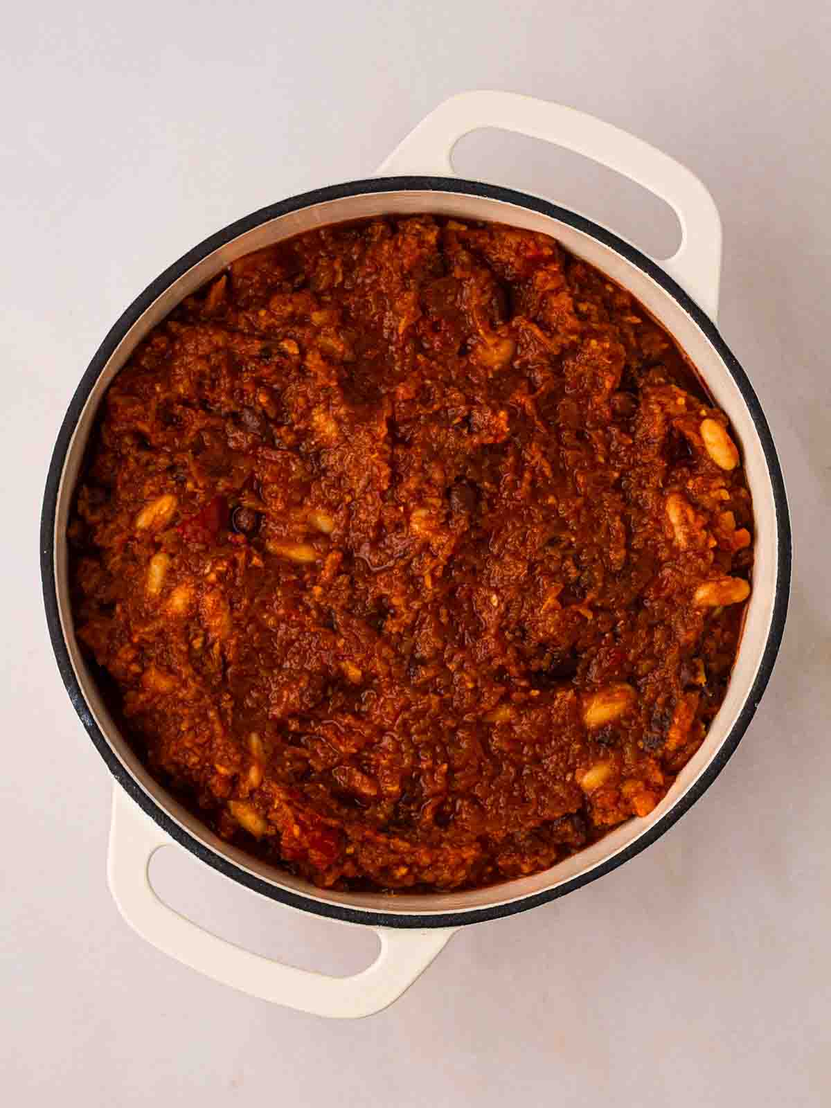 A pan filled with vegan chilli in the middle of cooking.