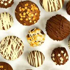 A collection of Hot Chocolate Bombs decorated with an assortment of sizes.