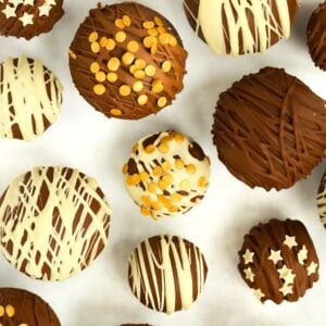 A collection of Hot Chocolate Bombs decorated with an assortment of sizes.