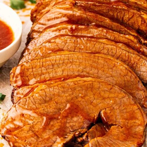 Slices of beef brisket in gravy, ready to be served up.
