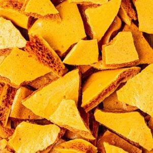 A close up of lots of pieces of homemade honeycomb.