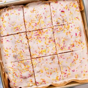 A square School Cake sponge with icing and sprinkles over the top, but into squares.