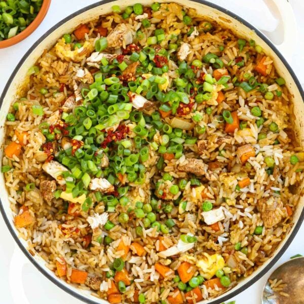 A large pan filled with cooked Chicken Fried Rice, ready to serve.