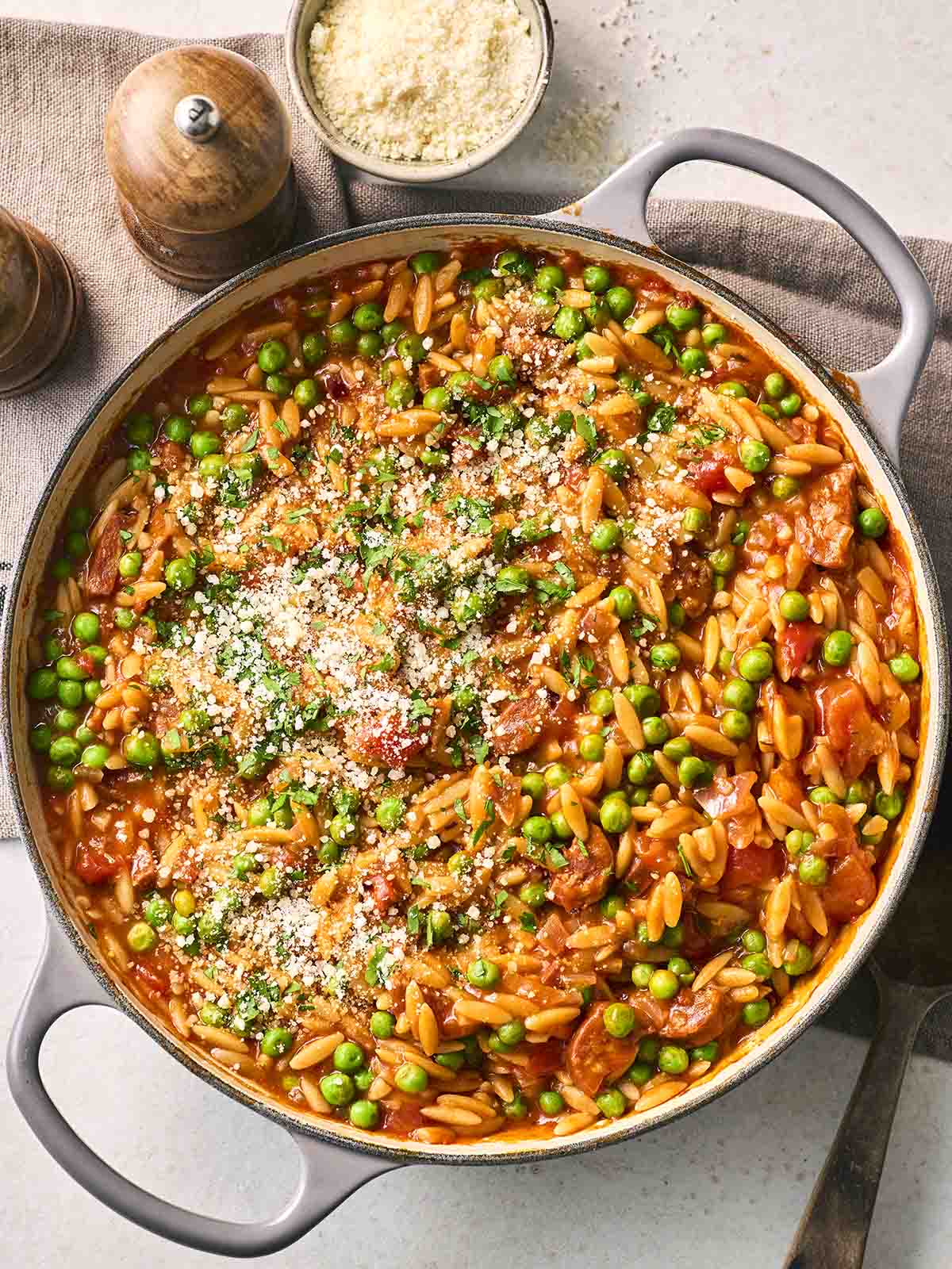 A large pan of cooked Chorizo Orzo, a delicious one pot recipe.