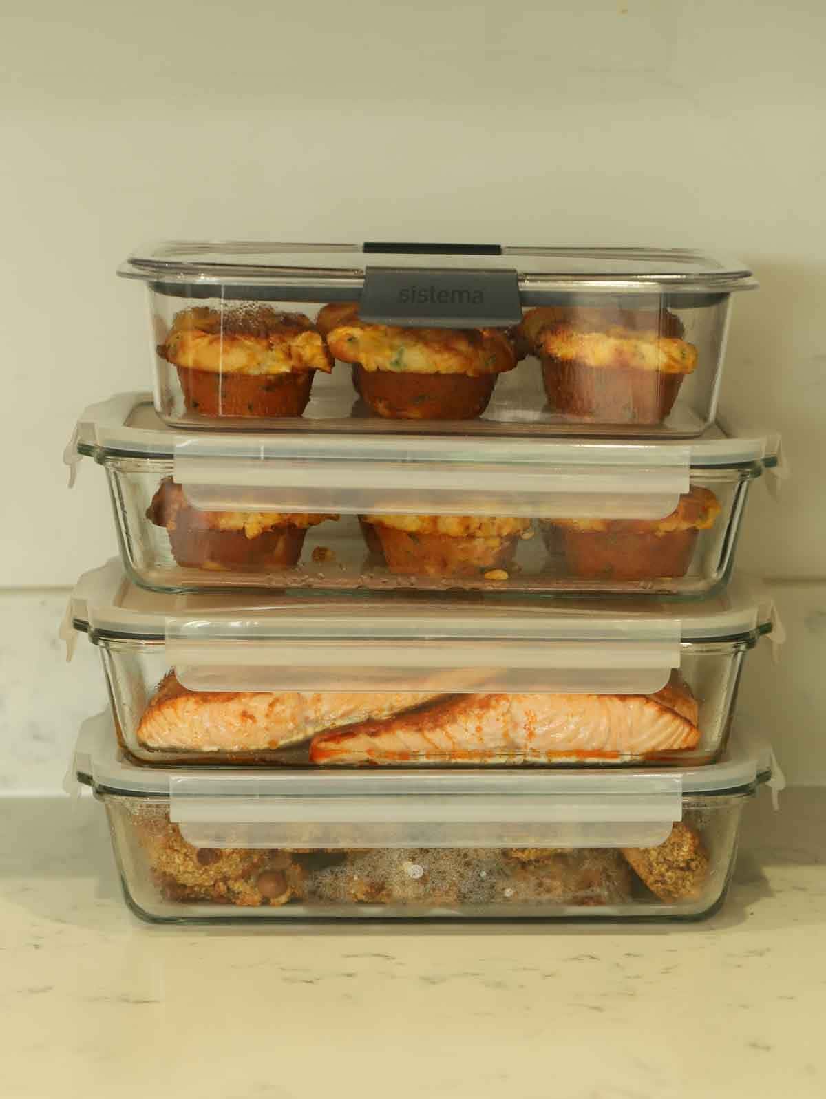 Sunday Setup Recipes for meal prep packed and piled into storage containers.