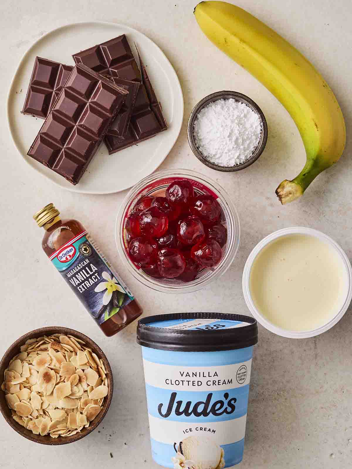 The ingredients for making a classic Banana Split laid out on a counter.