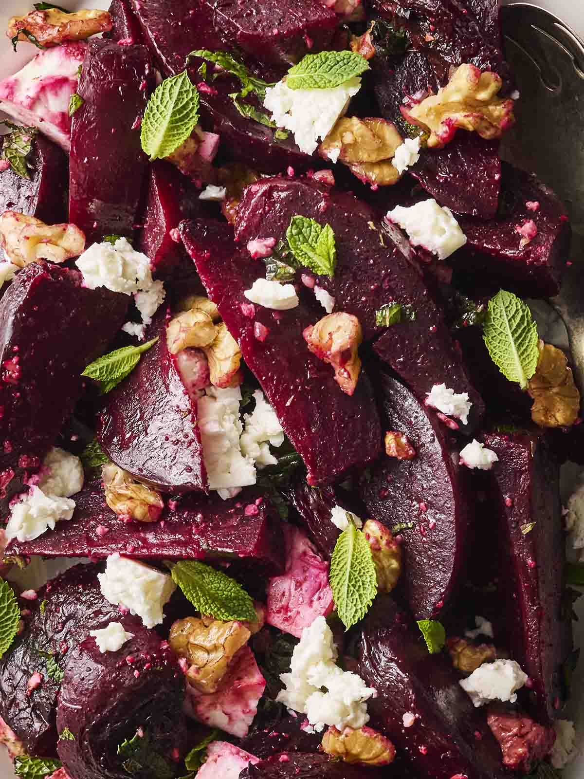 A close up of a Beetroot Salad with feta, mint and walnuts.