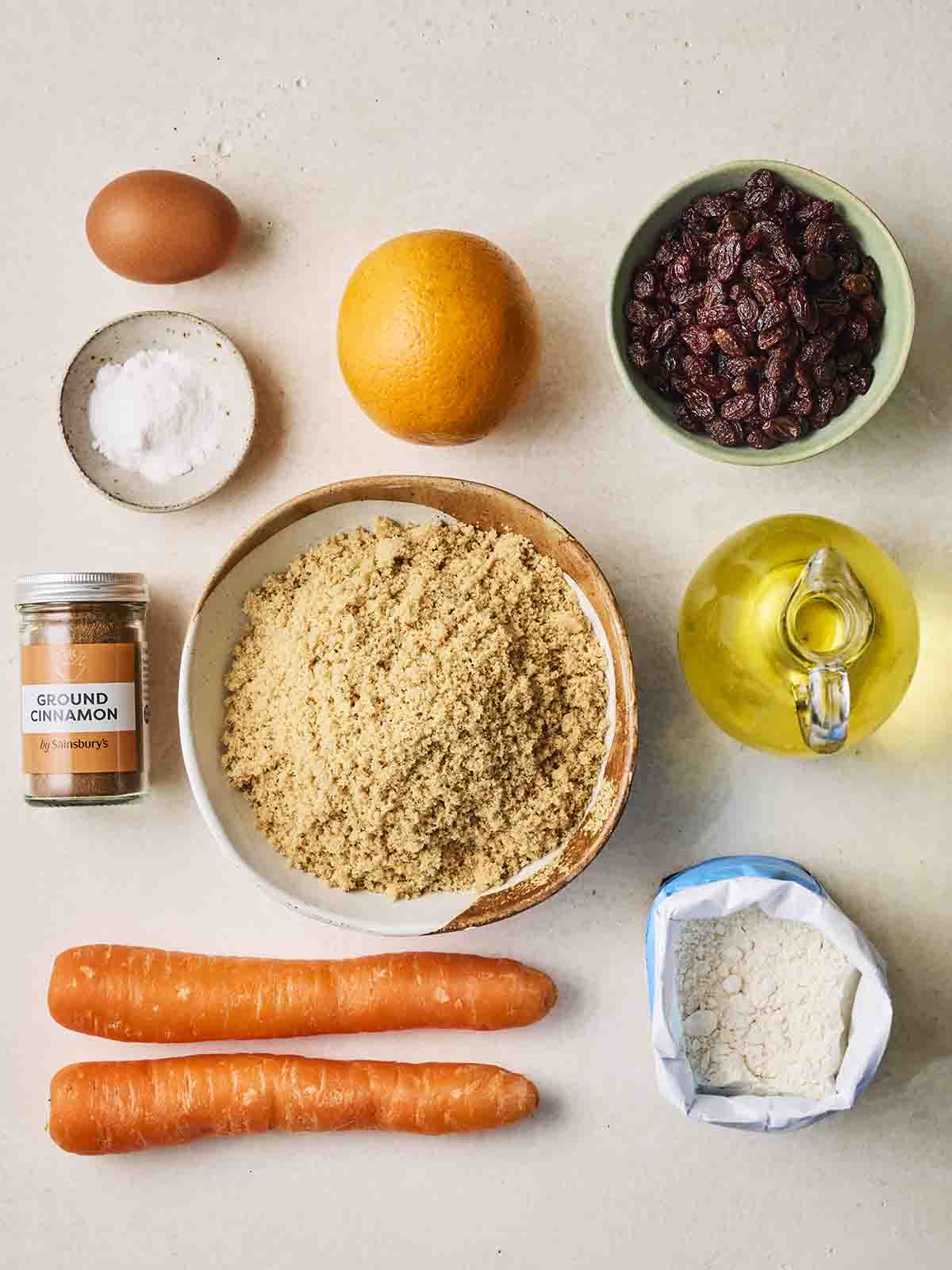 The ingredients for making Carrot Cake laid out on a counter.
