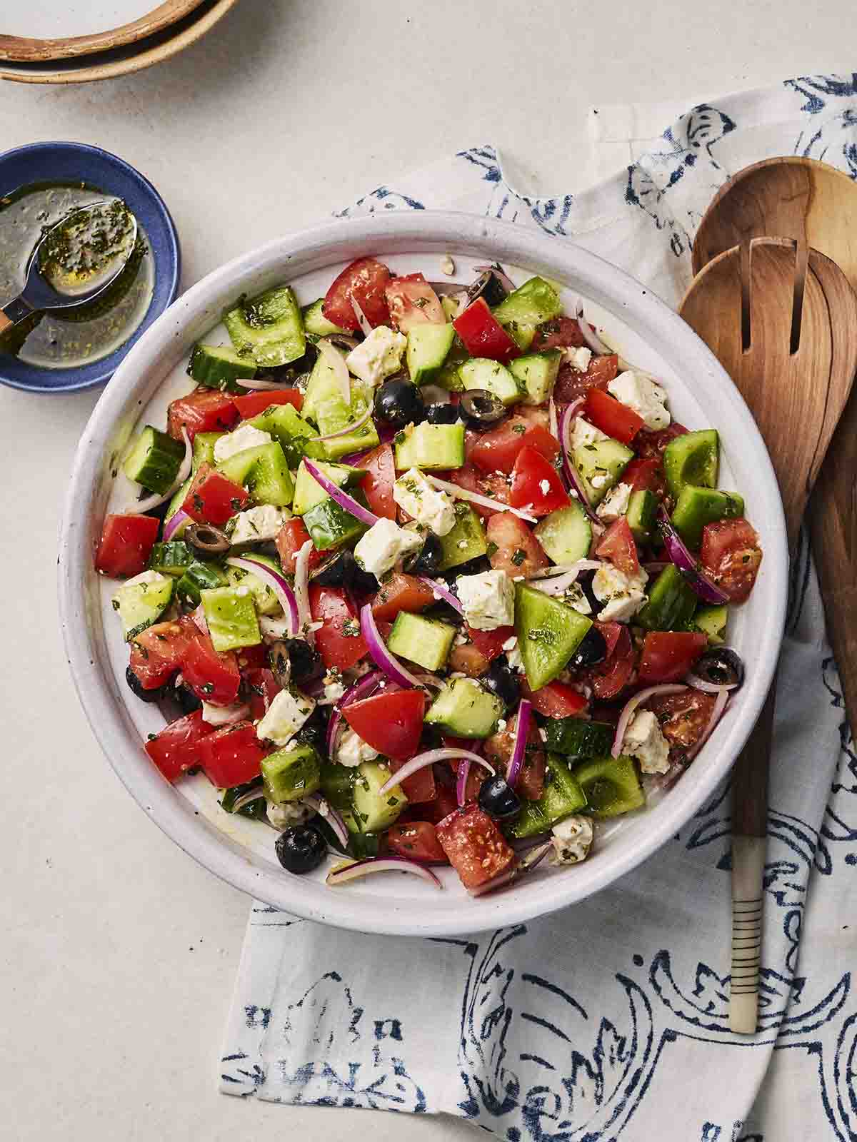 A bowl of Greek Salad on a table.