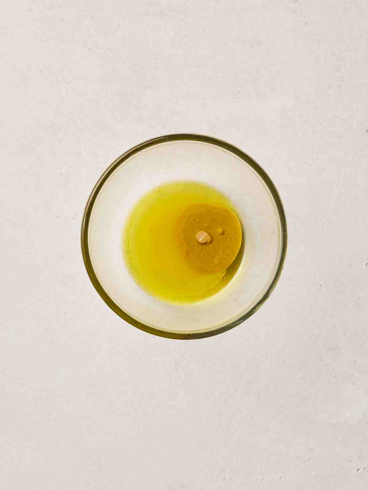 The Rice Salad dressing ingredients in a small glass bowl.