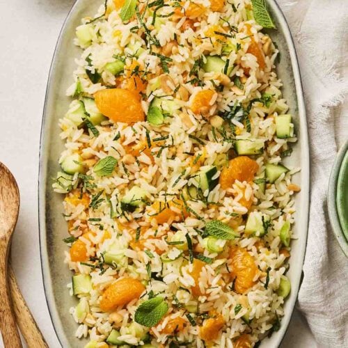 A Rice Salad on a platter on a table, ready to serve.