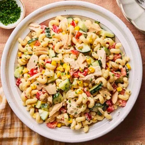 A tuna salad with pasta on a plate, ready to serve.