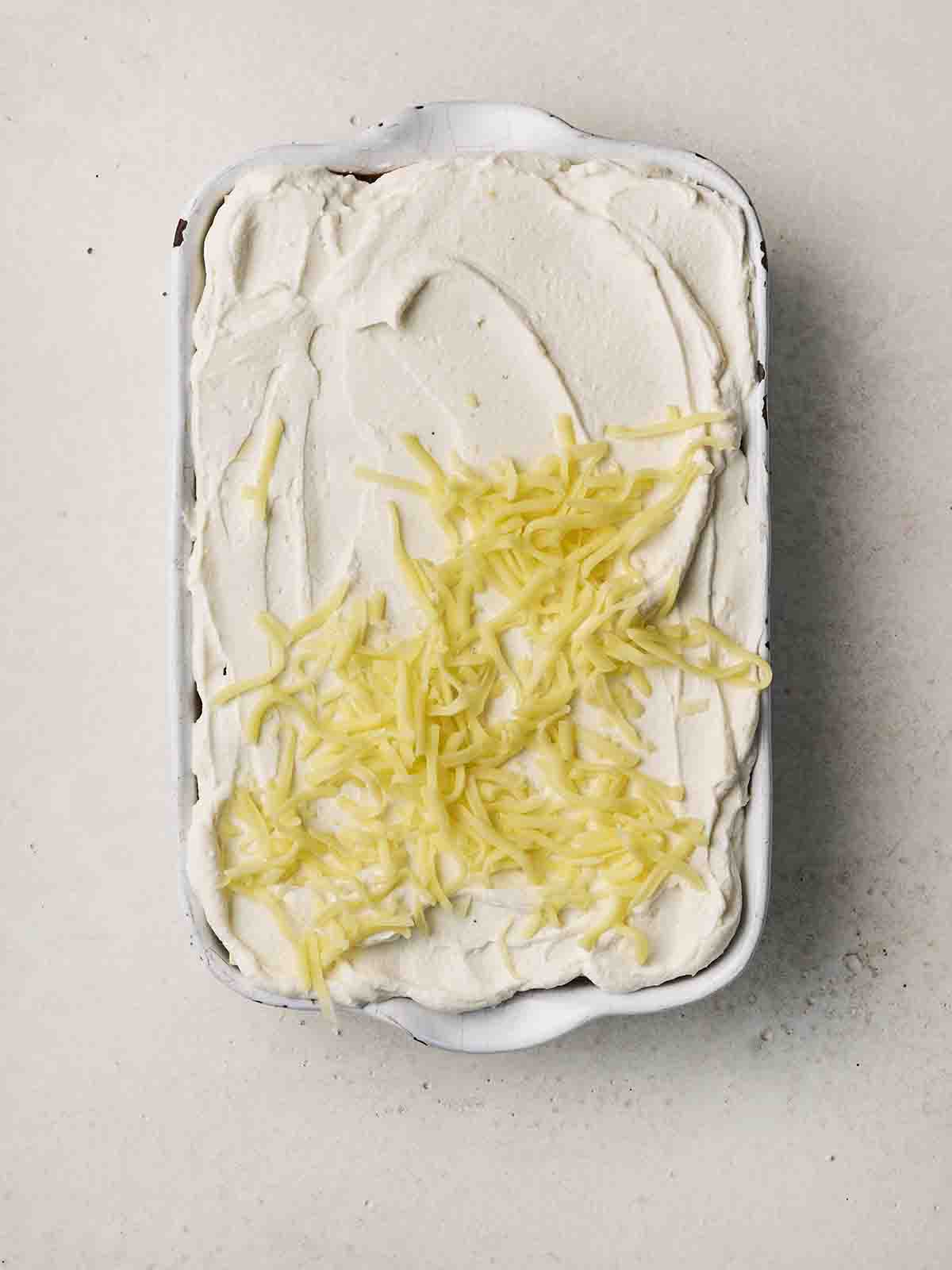 Cheese on top of a Vegetarian Lasagne before being baked.