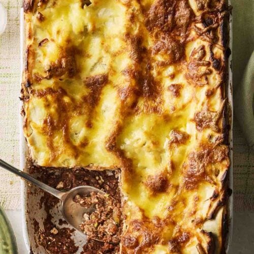A vegetarian lasagne with a piece cut out.